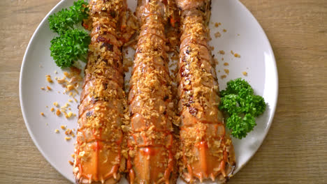 stir fried mantis shrimp with garlic on white plate