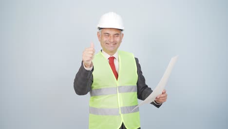 engineer looking at camera and making positive gesture.