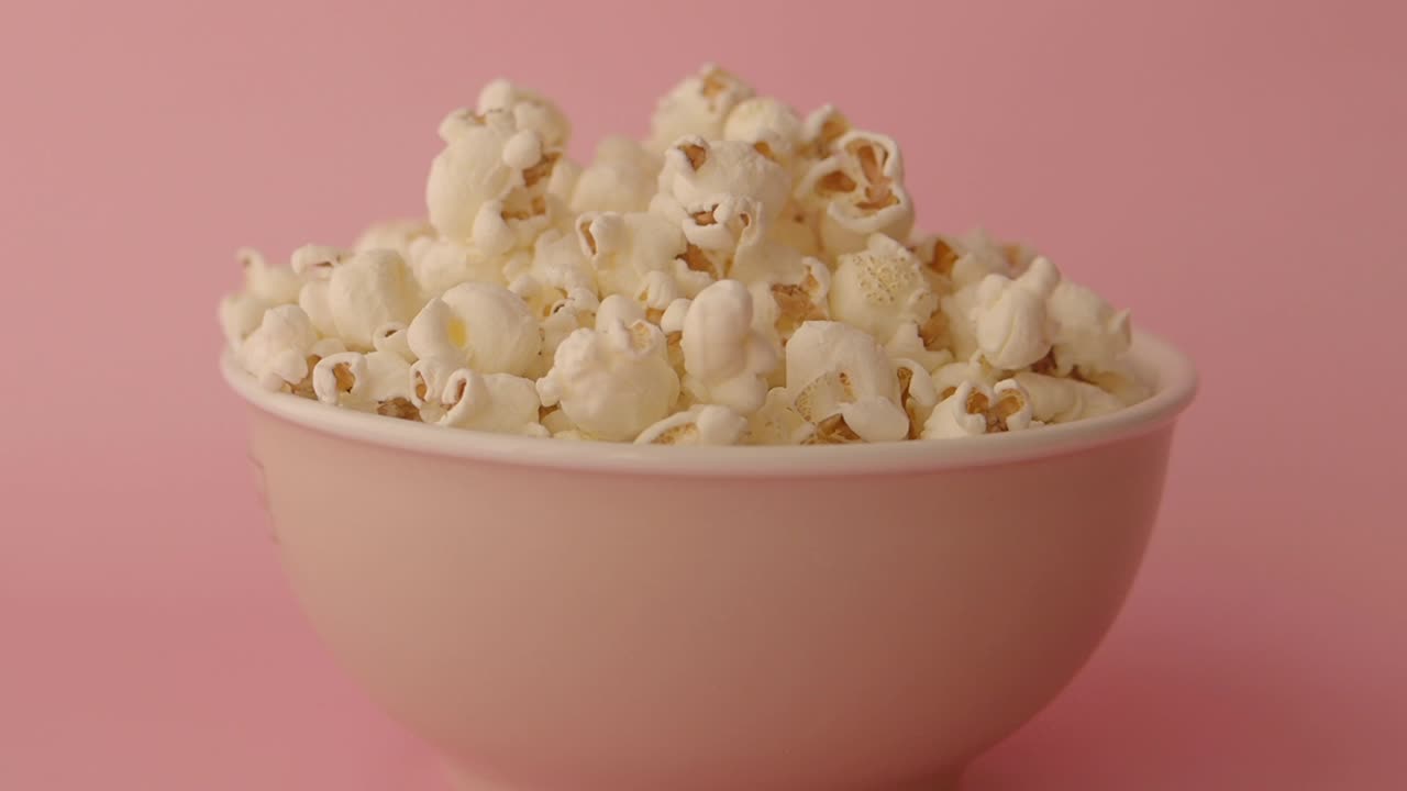Bowl of Popcorn on Pink Background