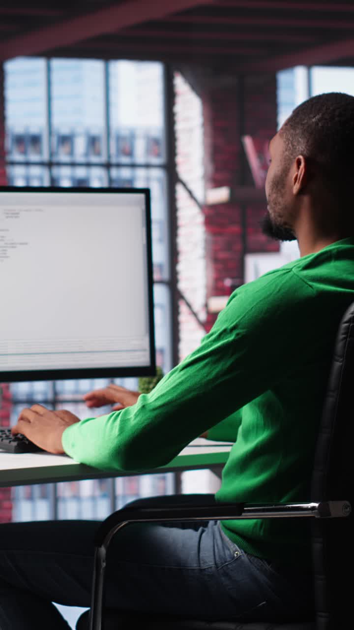 Vertical Video African American IT expert working with a computer full of code