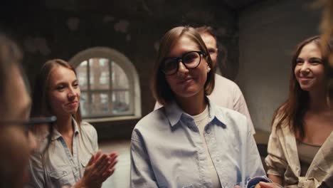 a girl with a bob and glasses in group therapy thanks the participants for the practice of trust. an overview of gratitude and mutual aid in group therapy