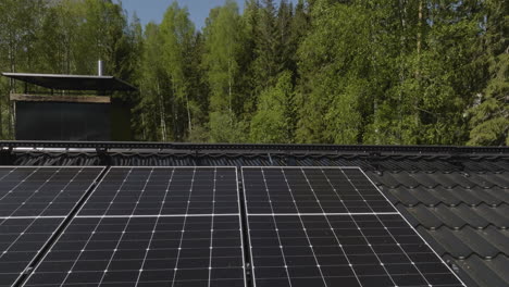 solar panels on house roof in forest