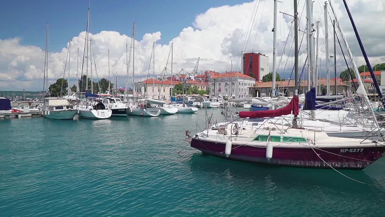 Stunning HD footage of various boats and saliboats docked in Koper's marina in Slovenia