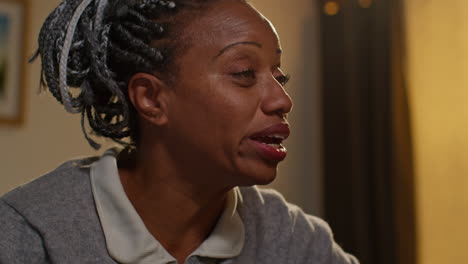 woman with braids talking