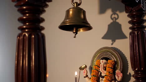 indian temple with ganesha statue and bell