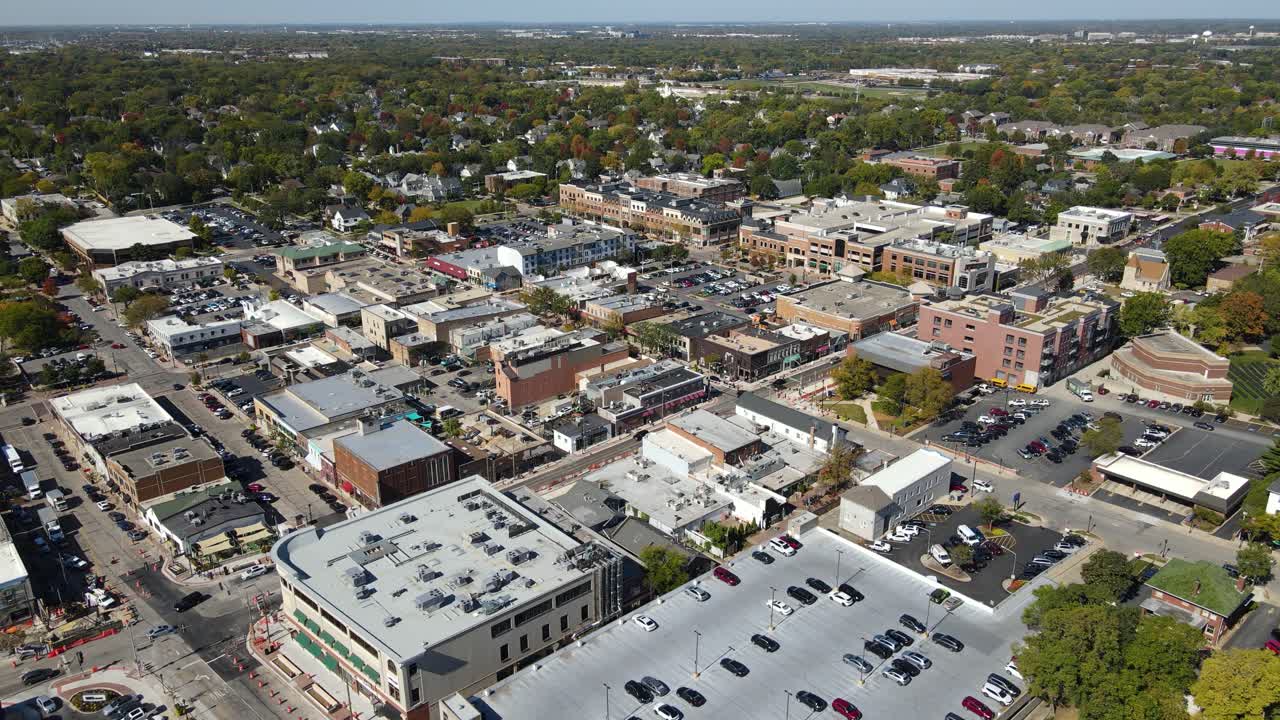 Naperville, IL, a Chicago suburb, on a sunny fall day, featuring buildings, streets. Crane Up Left Day NW