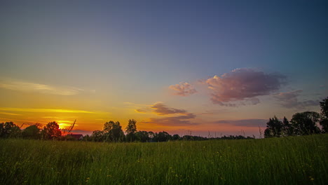 early morning to dusk sunset time lapse over rural landfield