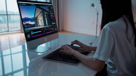 woman designing modern house on computer