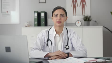 sad indian female doctor talking to the patient