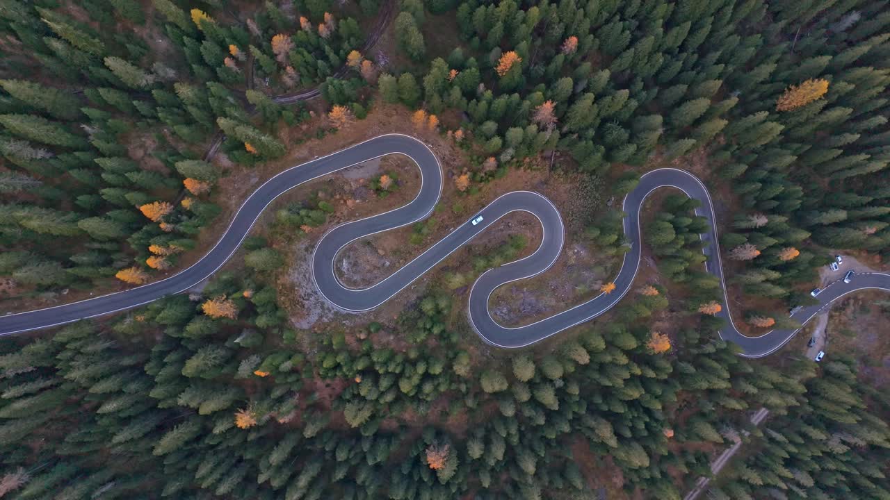 Snake Road twists through rugged peaks, Dolomites, seen from above