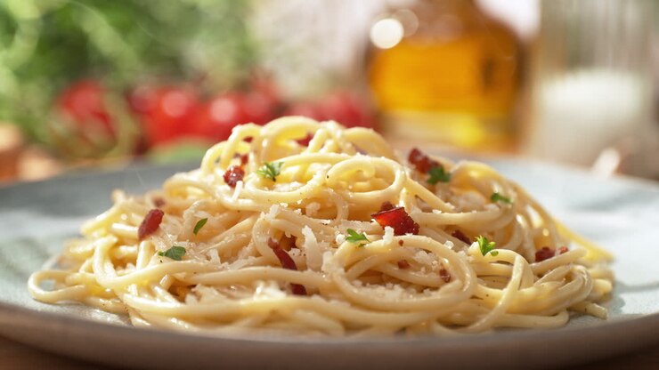 Spaghetti Carbonara Served with Pancetta on a Plate - Presentation of the Main Course in a Sunny Italian Restaurant, Packshot, Dolly out