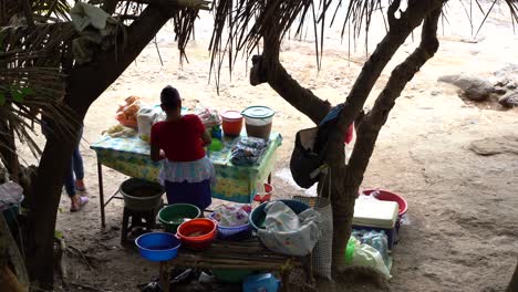 people selling food on the rocks in el salvador