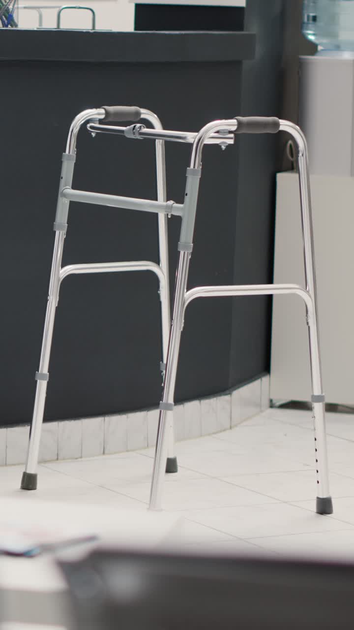 Vertical video: Clinical waiting area with walking frame