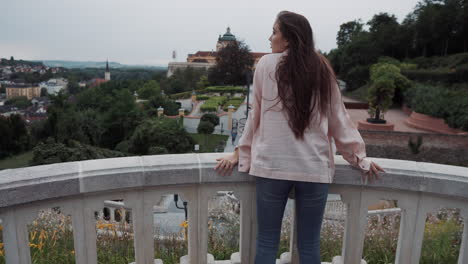 woman enjoying the view from a city stairs