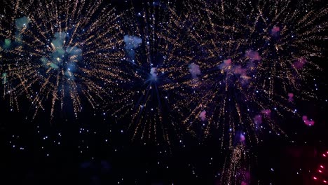 Colorful-fireworks-exploding-in-the-night-sky.-Celebrations-and-events-in-bright-colors.