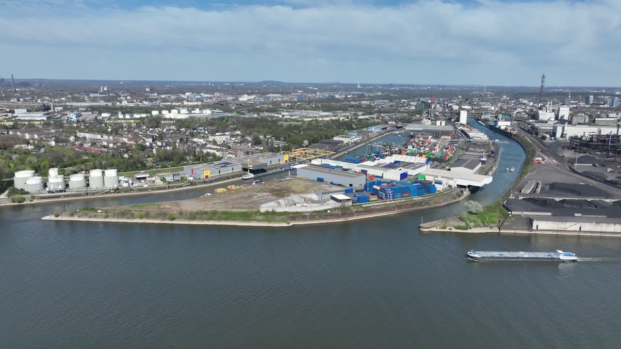 Rhine river, industrial ruhr region, shipping waterway for industrial transport. Infrastructure, Trade and industry in Germany. Aerial view.