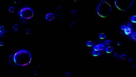 rainbow bubbles on a dark background, loop,