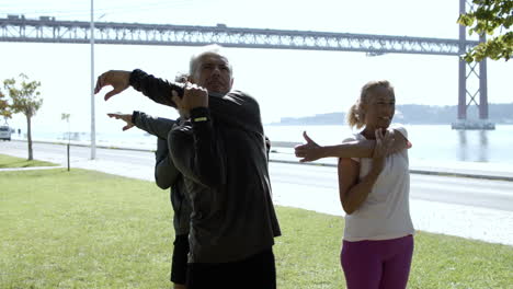 elder men and women stretching their upper bodies