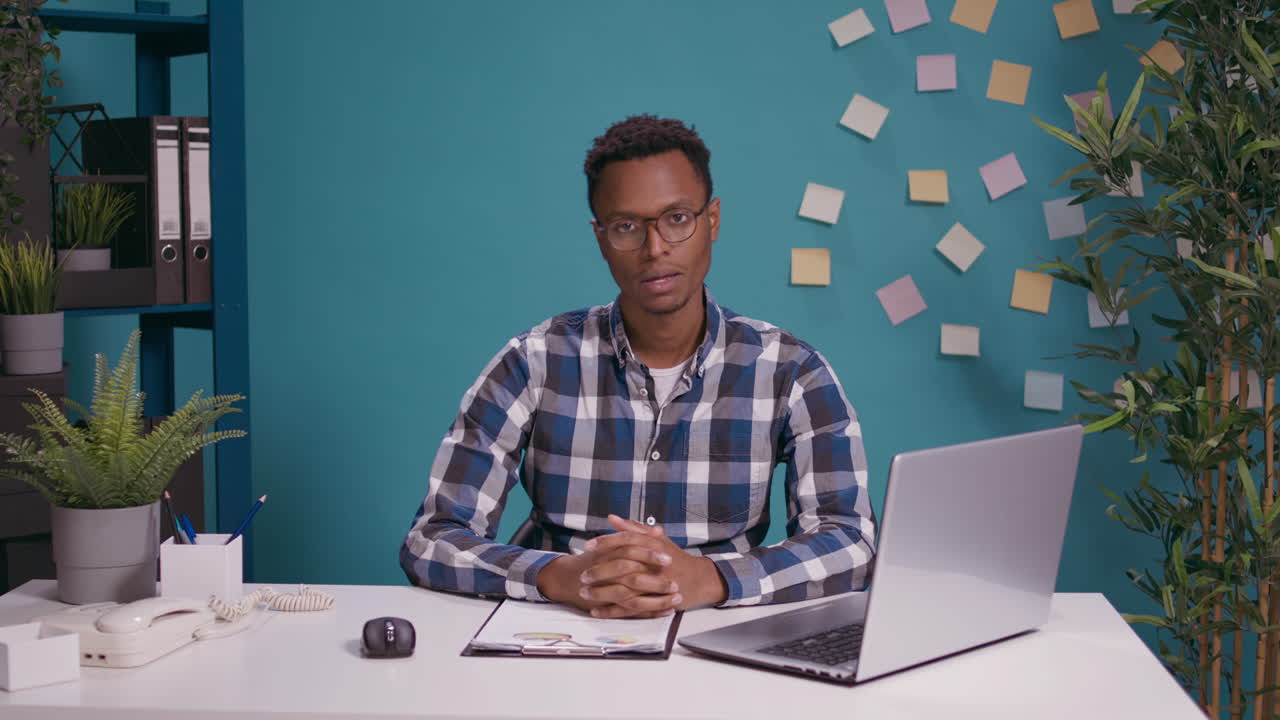 POV of employee attending video call conference at desk