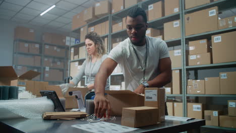 warehouse workers packing boxes