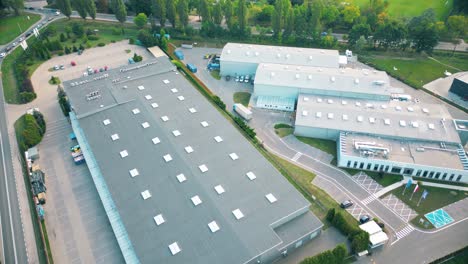 Aerial-view-of-warehouse-storages-or-industrial-factory-or-logistics-center-from-above