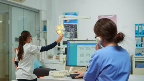 nurse answering the phone making dental appointments