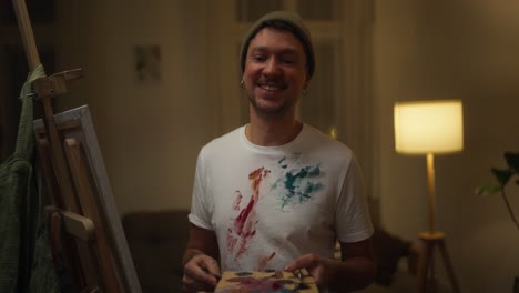 smiling artist at home studio