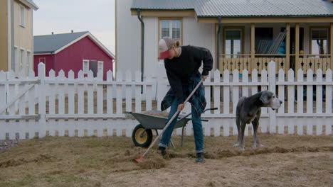 woman gardening in yard with dog