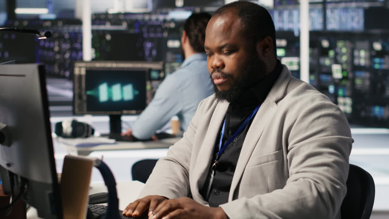 Vertical video Cheerful data center admin pleased after finalizing software upgrade