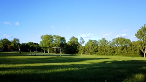 time-lapse of a summer sky with a soccer field in the foreground