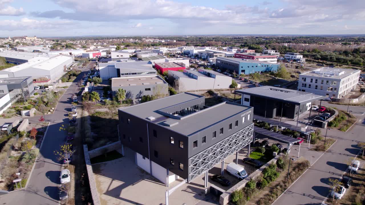 Aerial view of sustainable office reveals a modern architectural marvel nestled amidst cityscape