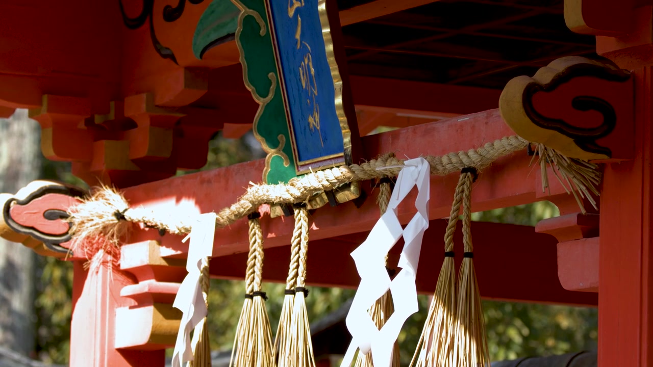Traditional Shinto Shrine Gate with Shimenawa Rope and Paper Streamers