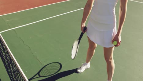 woman playing tennis on a sunny day