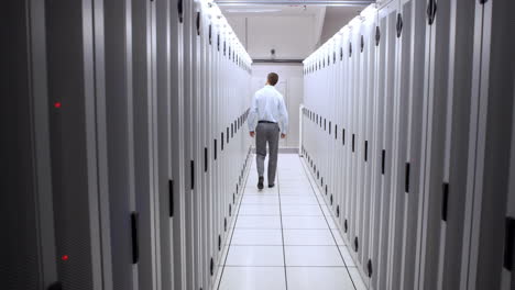 technician walking in server hallway