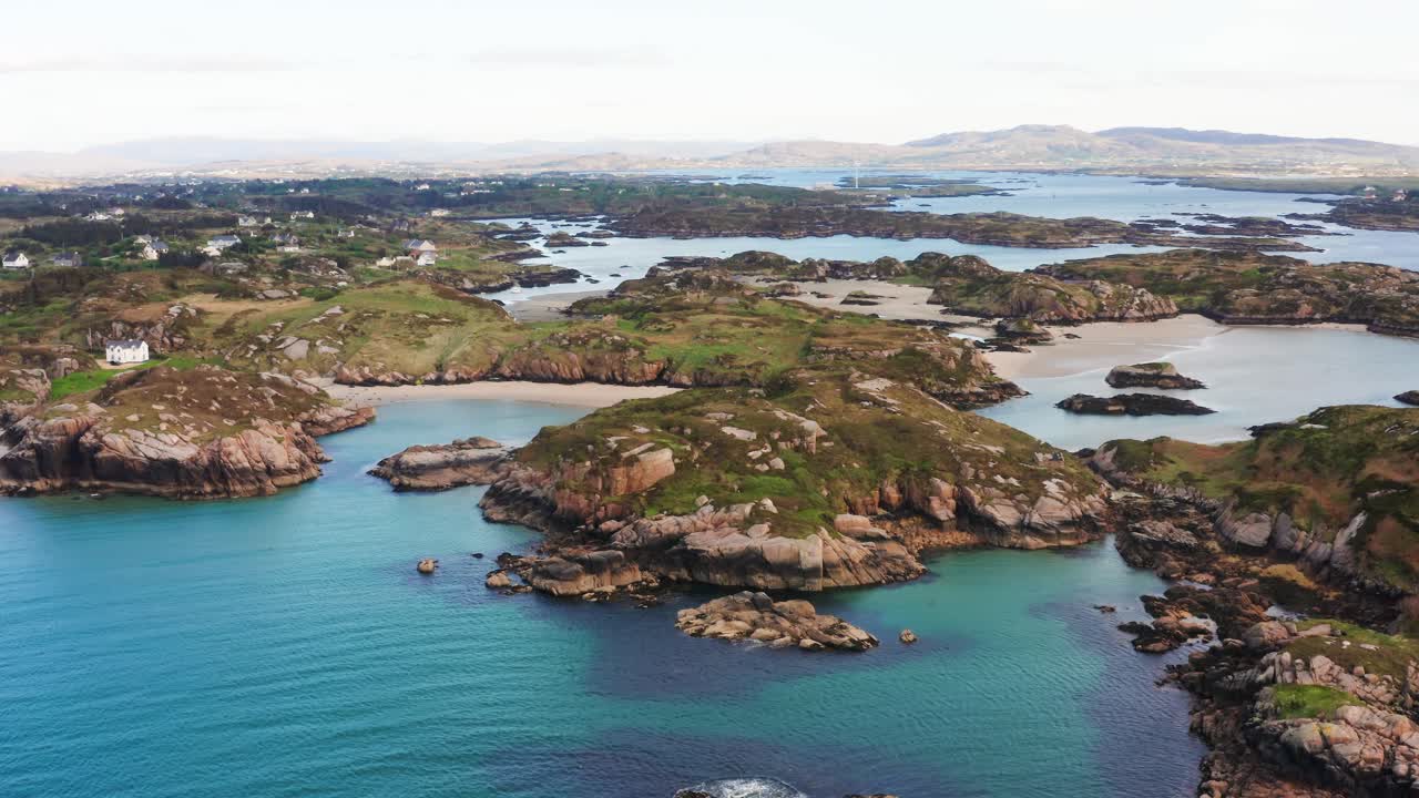 Coastal Flyover Capturing the Serene Beauty of Cloughglass Bay’s Unique Shoreline with Homes in the View