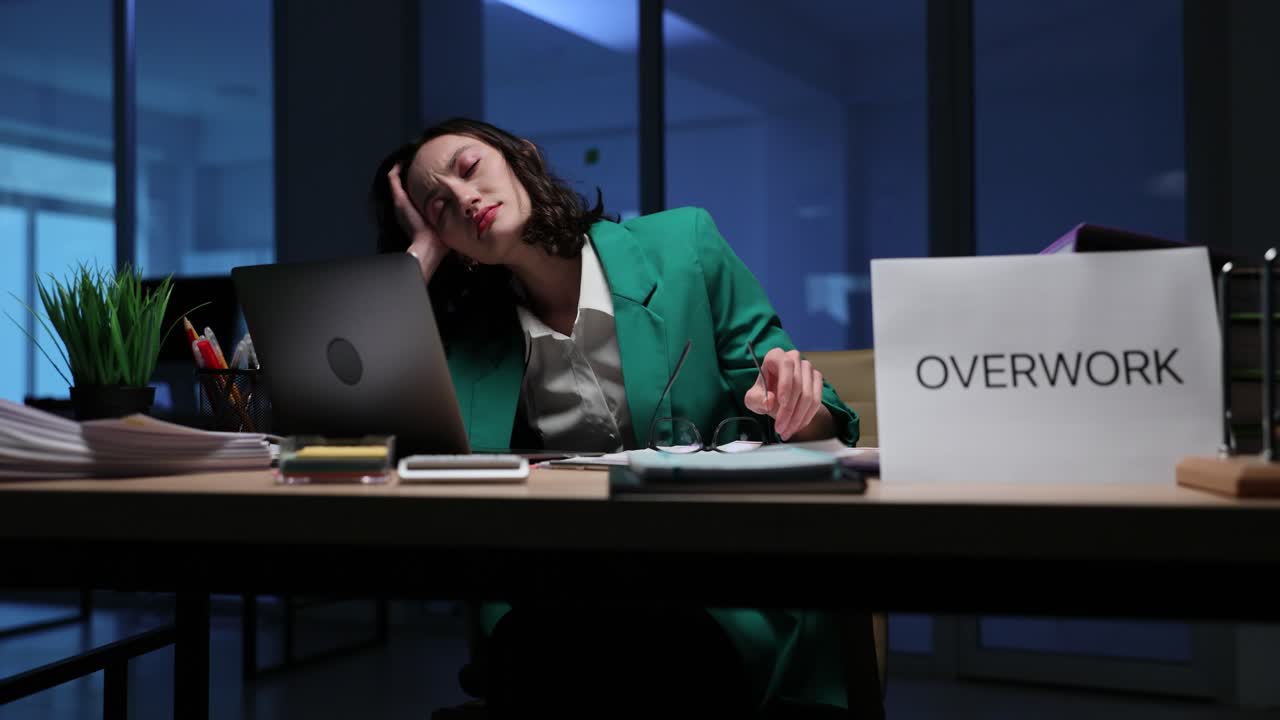 Overworked and Stressed Woman at Her Desk