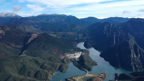 aerial views of a lake in the pre pyrenees in catalonia with beautiful mountains surrounding it