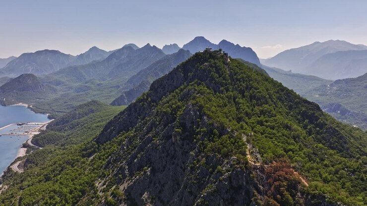 Antalya Turkey Aerial v45 cinematic drone flyover konyaaltı capturing tünektepe coastal mountain ranges on a sunny day during hot summer season - Shot with Mavic 3 Cine - July 2022