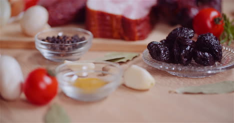 Close-Up-Of-Allspice-Curry-Dried-Plumps-And-Garlic-Rotating-On-Table