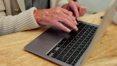 senior typing on laptop