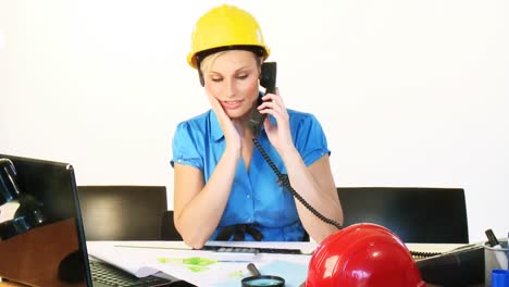 Architect-woman-on-phone-in-office