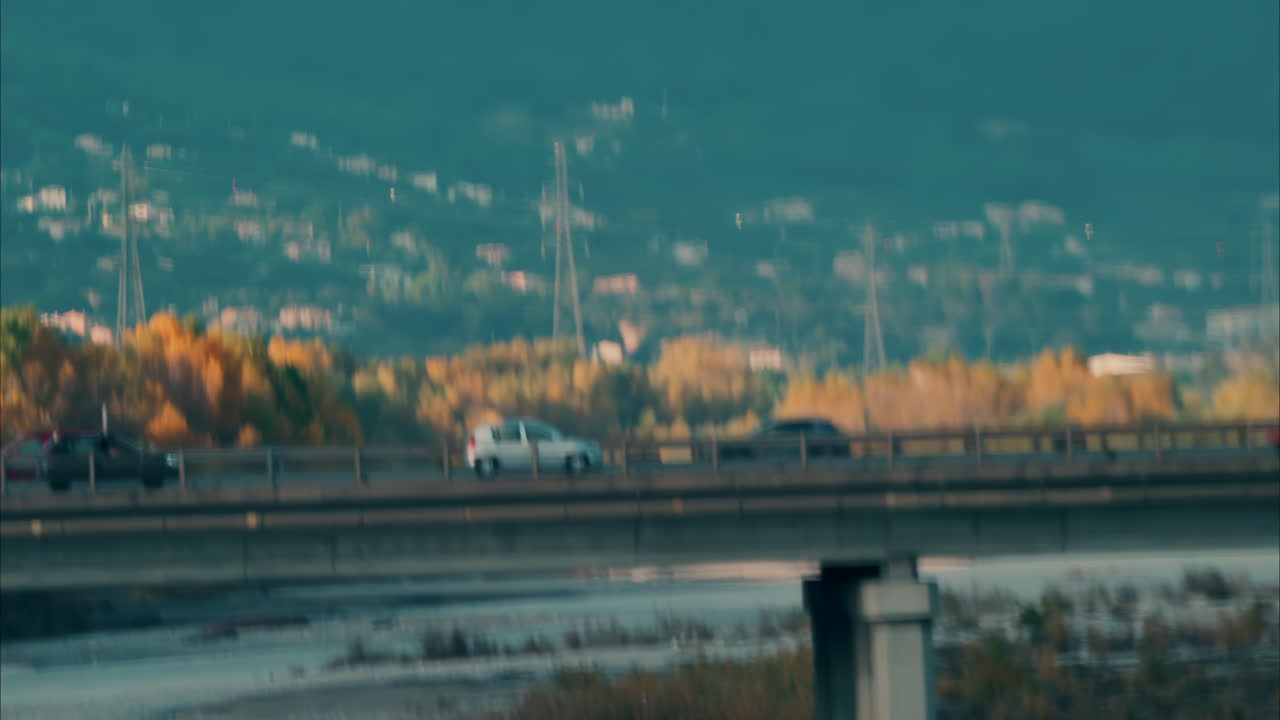 Blurred view of cars moving on a bridge over the Var river in Nice, France