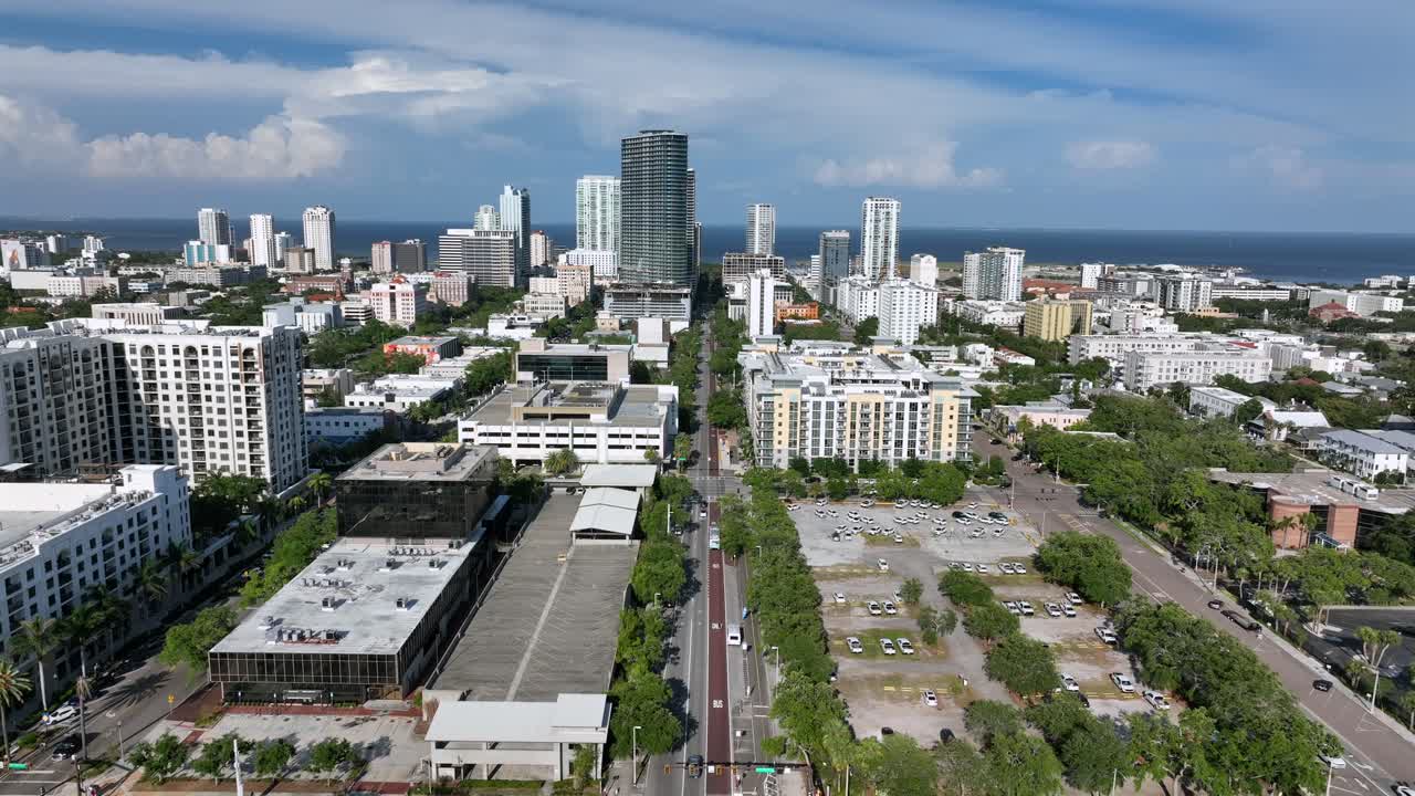Skyline downtown of Saint Petersburg, Florida at sunny day. Aerial wide shot. Sunny day with blue sky. Skyscraper and bike lane near Tropicana arena.