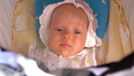 Portrait-of-baby-girl-in-stroller