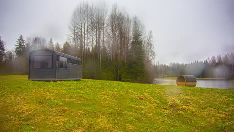 Wooden-Cabins-At-The-Countryside-With-Time-Lapse-Of-Seasons-Changing-From-Springtime-To-Autumn-To-Winter
