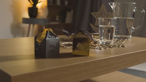 Close-Up-Of-Gift-Boxes-On-Table-In-Muslim-Home-Celebrating-Eid-3