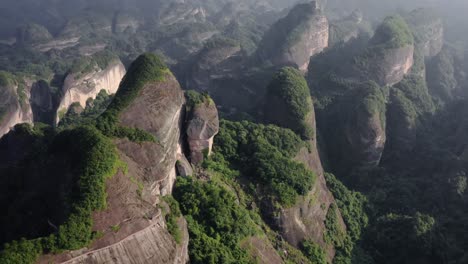 aerial: bajiao shan mountain valley, karst mountains in guangzhou china