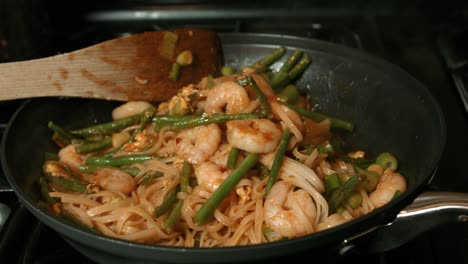 Pad-Thai-with-King-Prawns,-Noodles,-Spring-Onions-in-Hot-Frying-Pan