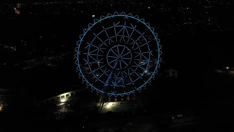 Aerial:-Newest-Ferris-wheel-at-Aztlan-Parque-Urbano,-Mexico-City,-night-light-show