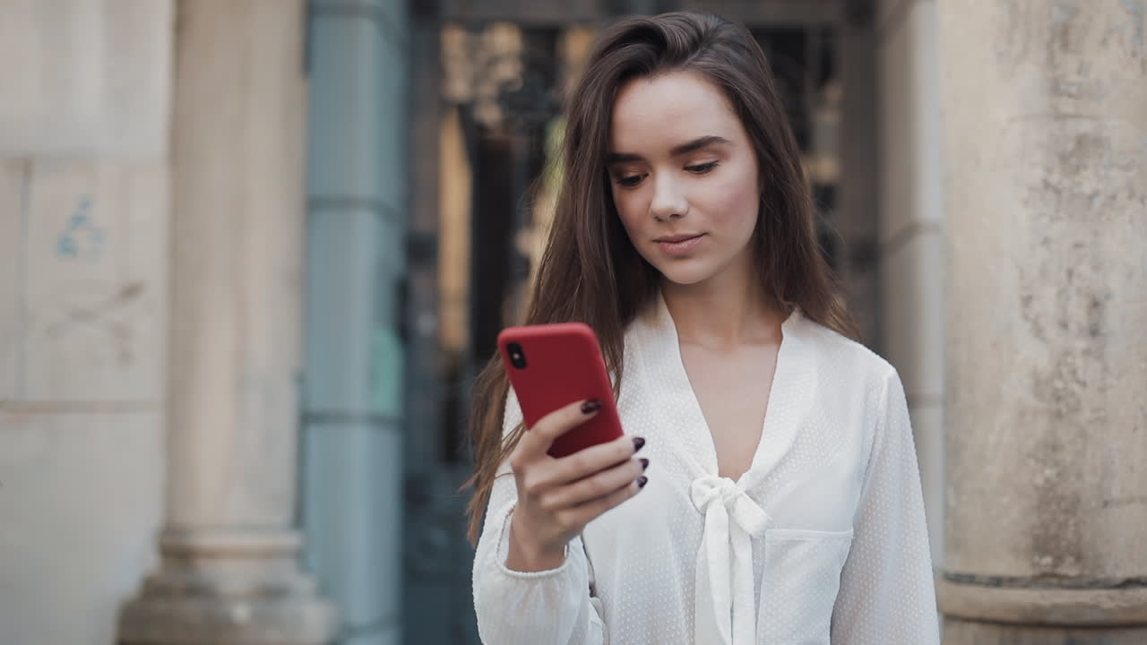 Woman with Phone Outdoors